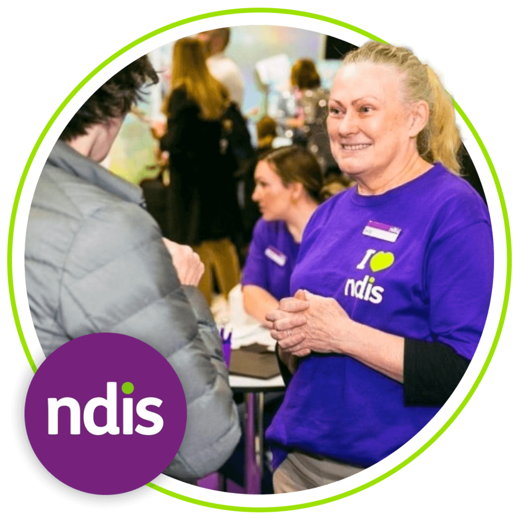 Image of NDIS worker smiling and chatting with another person