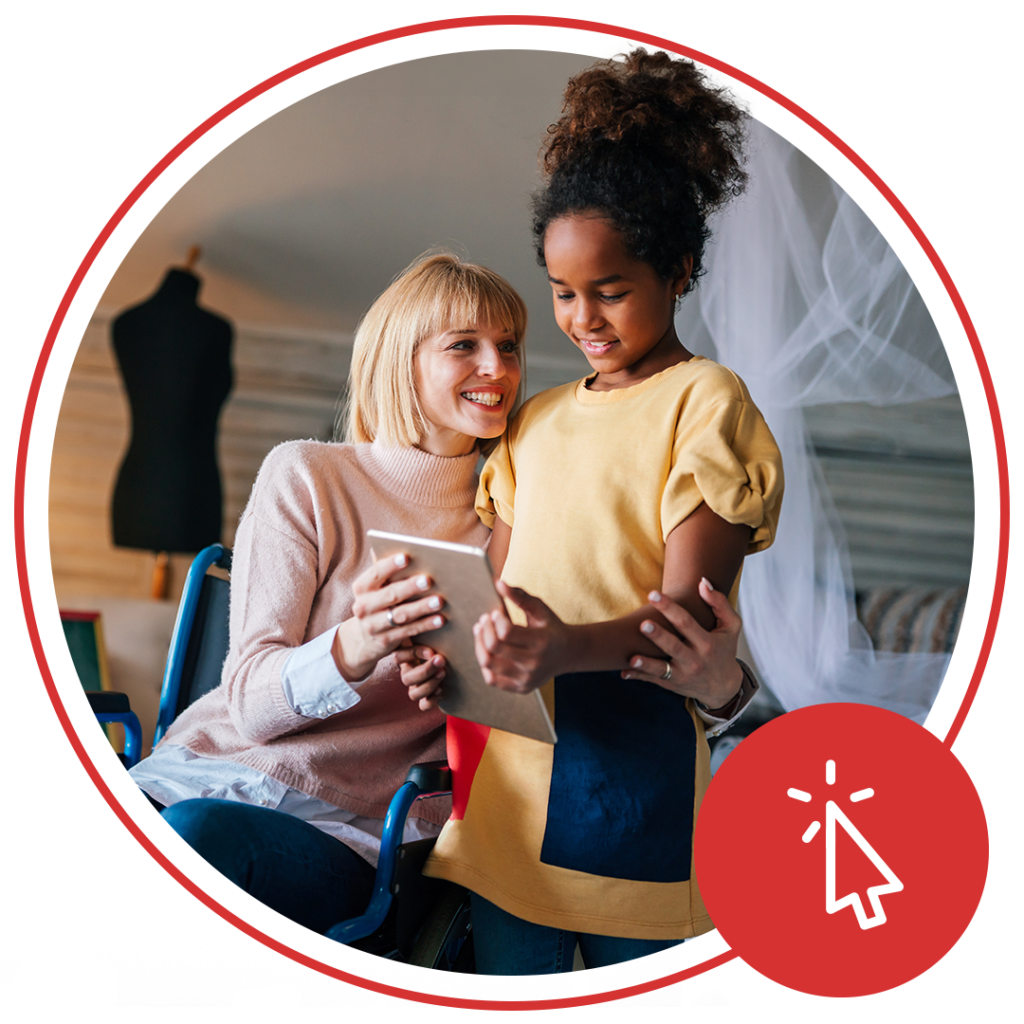 girl and older woman looking at a tablet device together