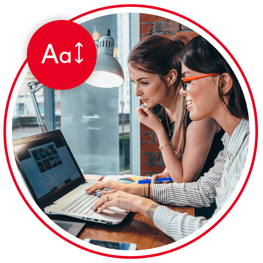 two people using a laptop