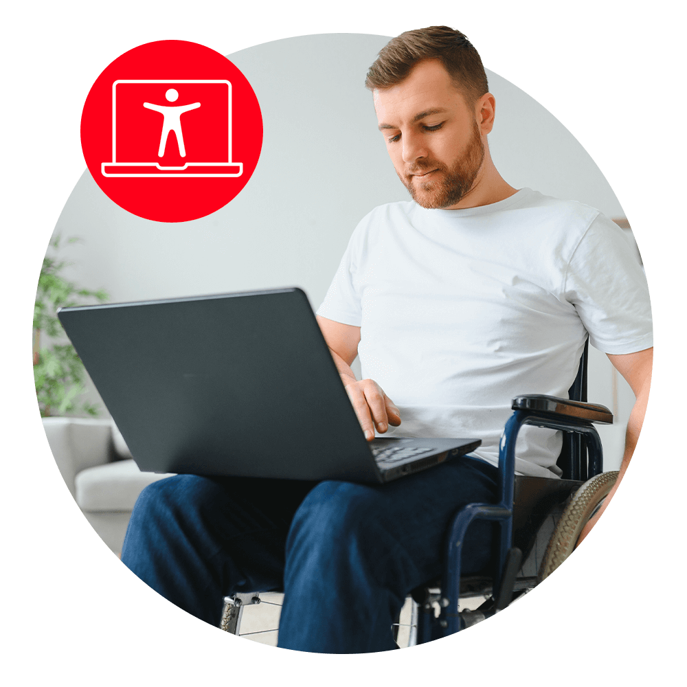 man sitting in wheelchair with laptop