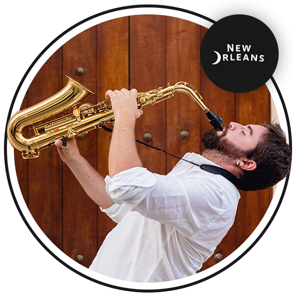 Image of a young man playing the saxophone with the New Orleans & Company logo