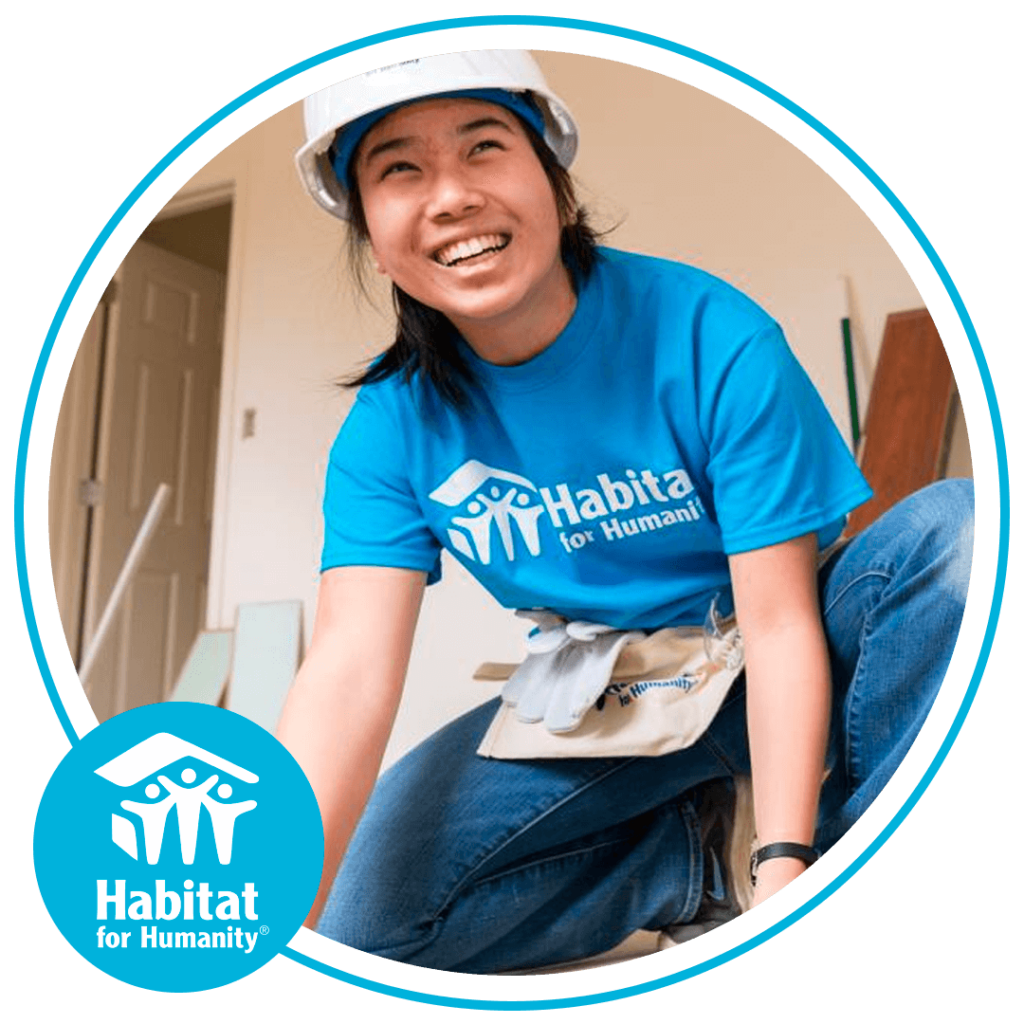 Image of a young woman with a Habitat for Humanity shirt at a build suite