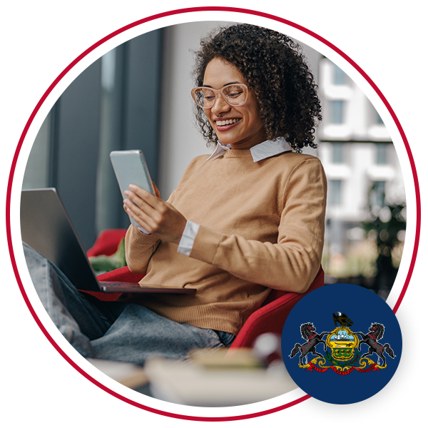 Woman sitting in chair using mobile phone