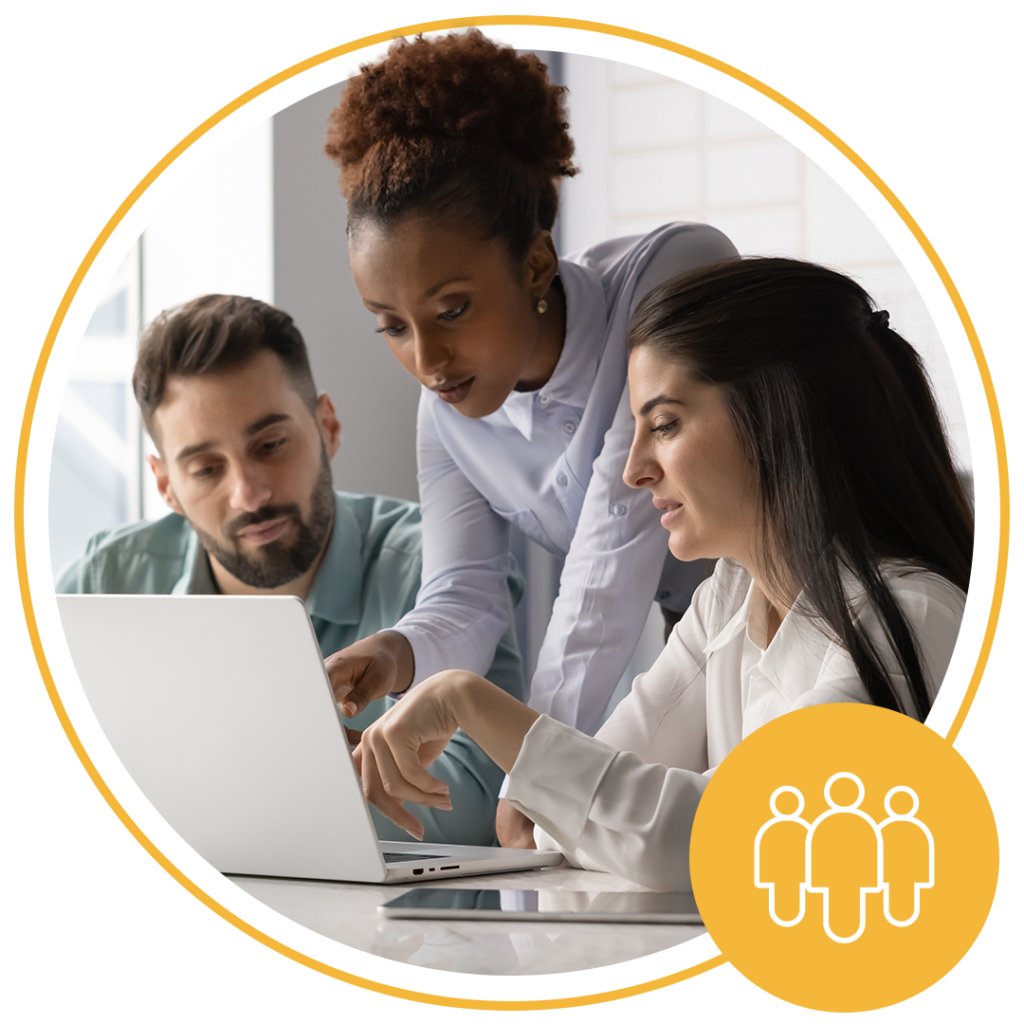 three people sharing a computer screen and discussing ideas
