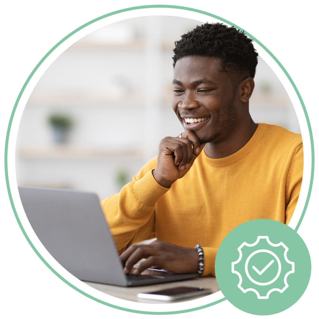 man sitting down using laptop