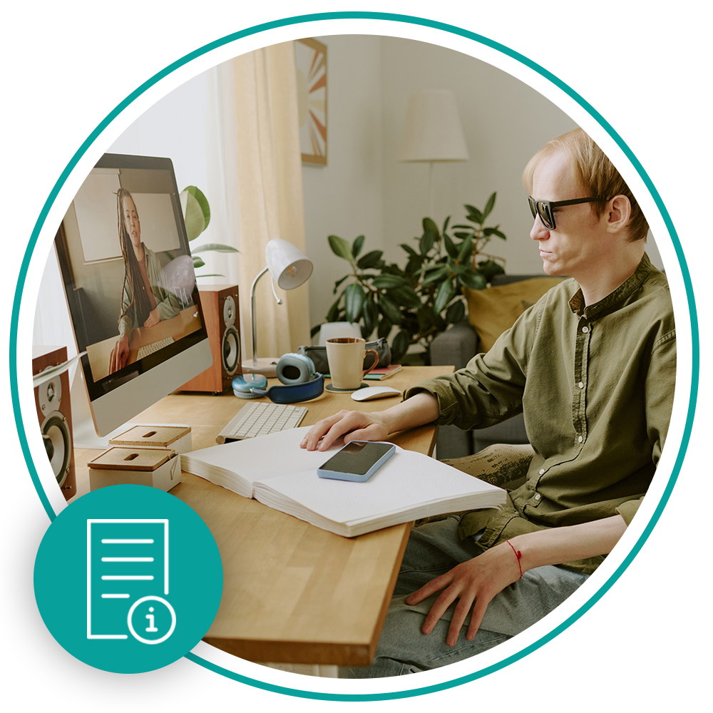 man with glasses using computer