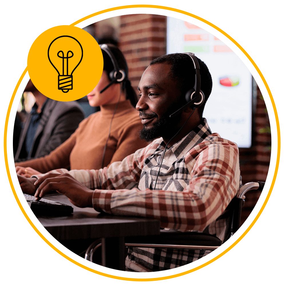 man using computer with headphones on