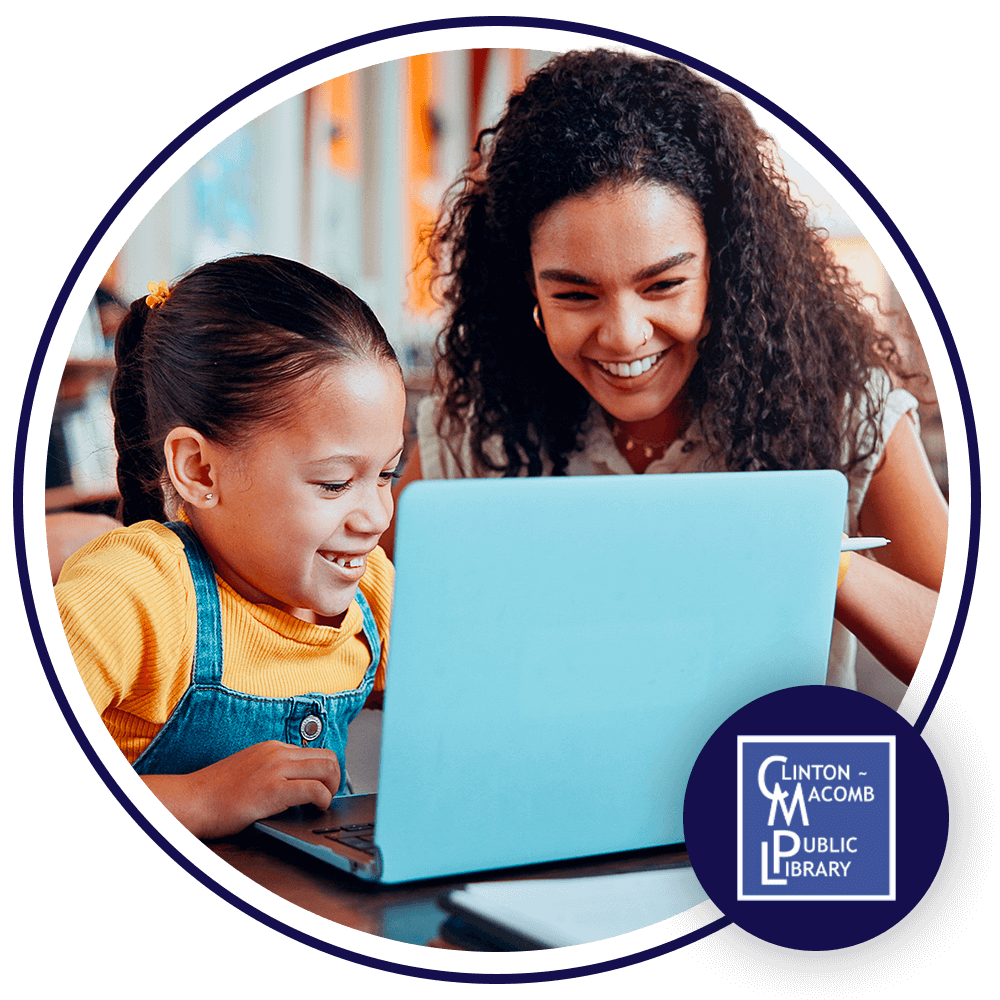 Image of a young girl and a woman sitting down and looking at a laptop. They are both smiling