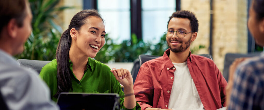 Group of colleagues talking in a modern office
