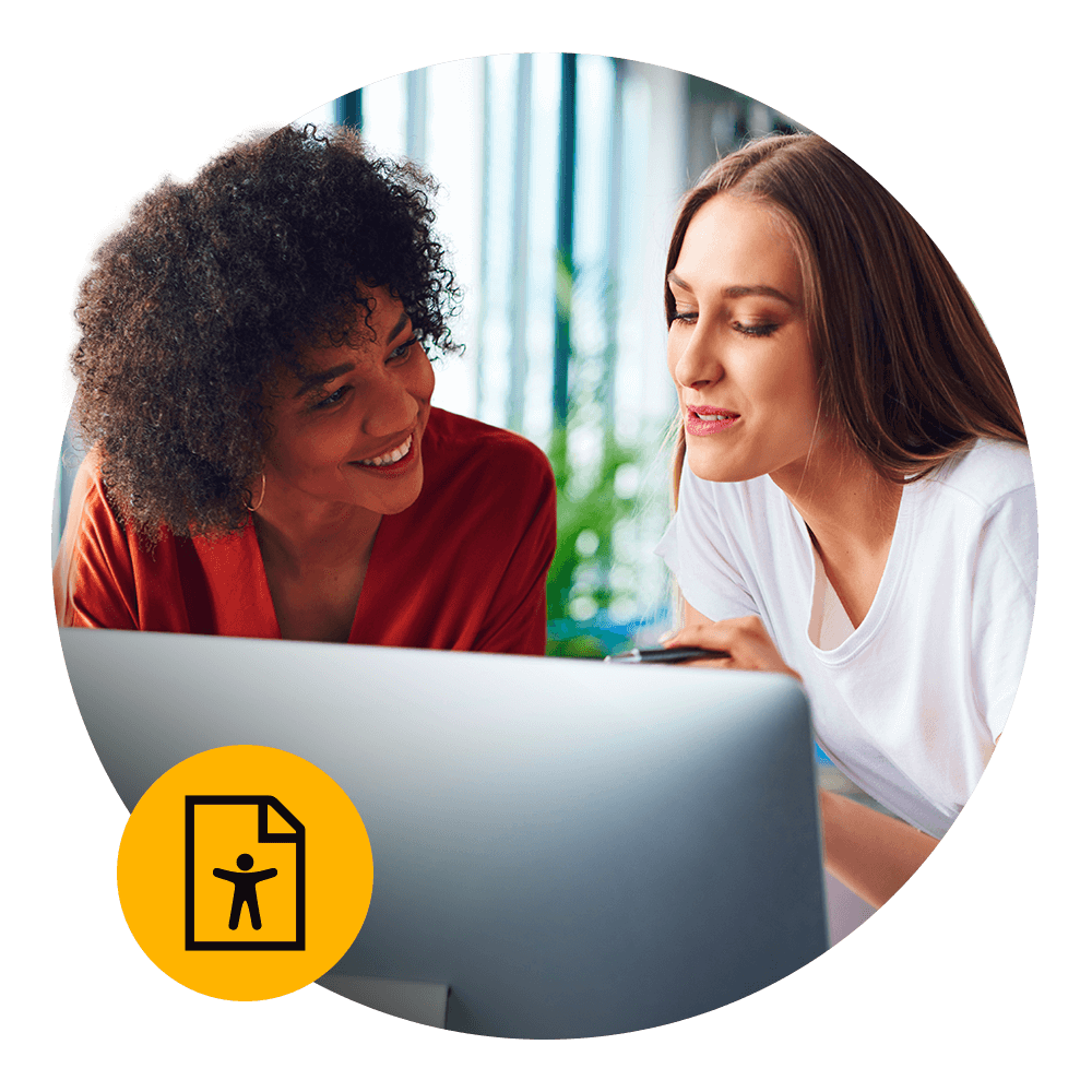 two women sharing a computer screen