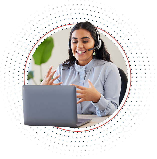 woman talking at a laptop with a headset on