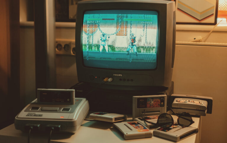 A picture of the Super Nintendo Console playing Mortal Kombat through a Phillips Television.