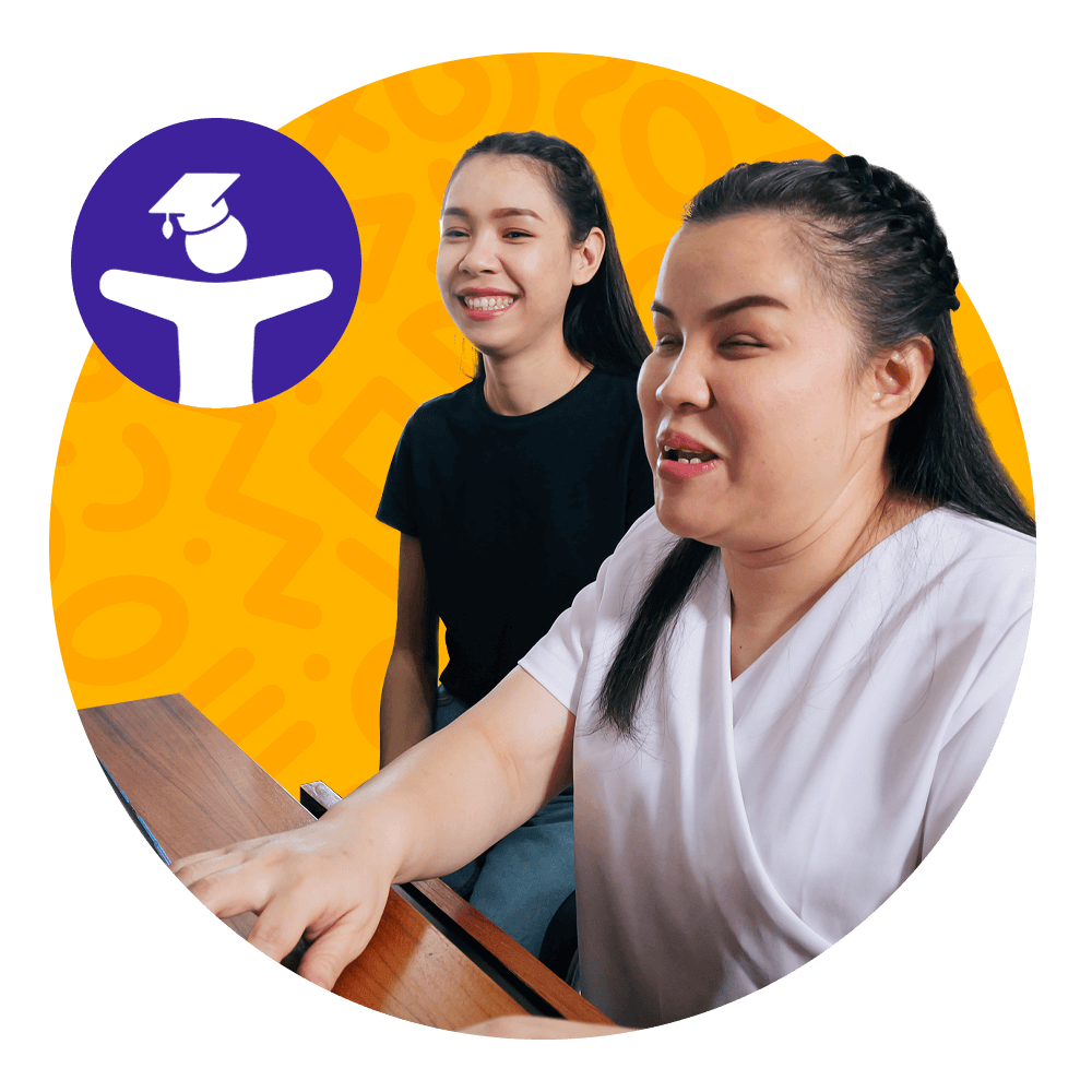 Two women sit together at a desk, smiling as they use a computer. One woman, wearing a white shirt, appears to be visually impaired and is using assistive technology. The background is bright yellow with abstract shapes, and there is a purple icon of a figure wearing a graduation cap.