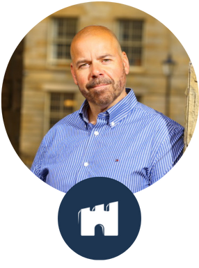 Headshot of james smiling into the camera with the castlepeak group logo at the bottom