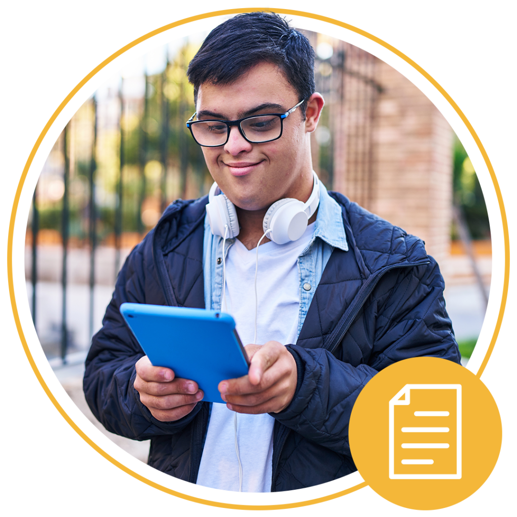 boy with glasses using tablet