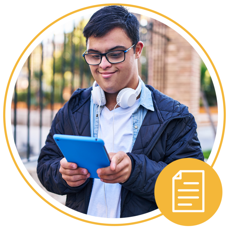 boy with glasses using tablet