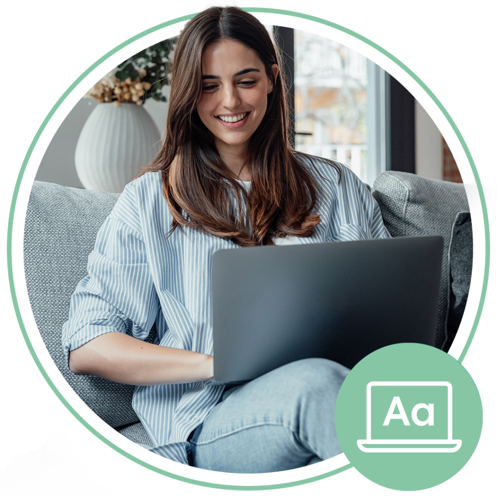 woman sitting down using her laptop