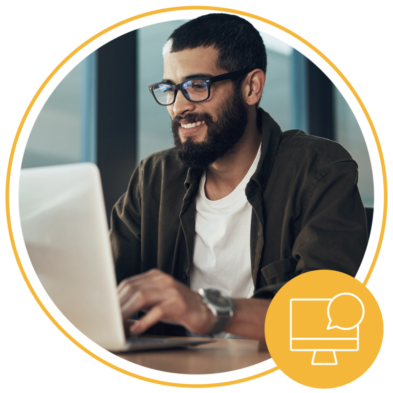 man using desktop and smiling