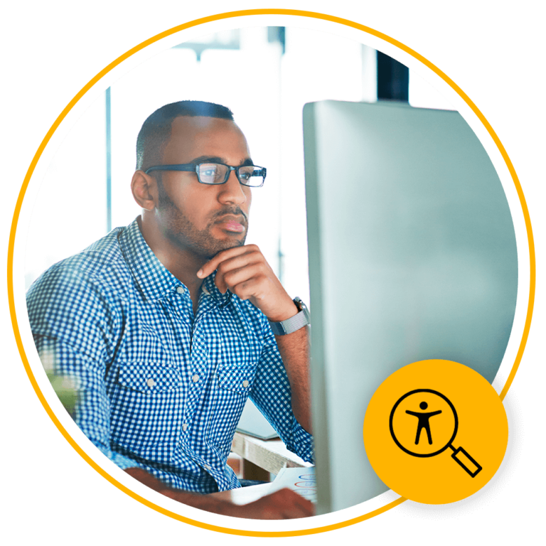 man with glasses using computer