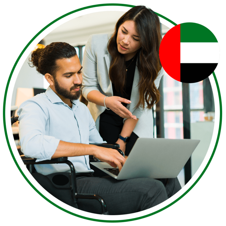 Man sitting in wheelchair using laptop