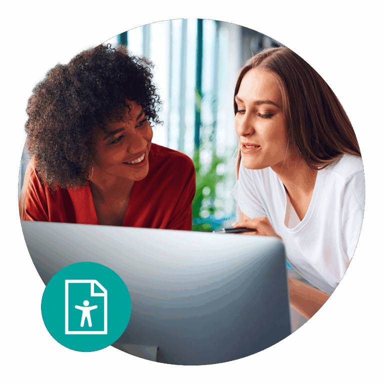 two women sharing a computer screen