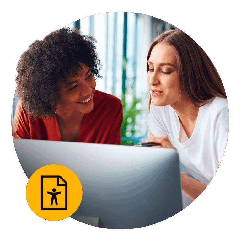 two women sharing a computer screen