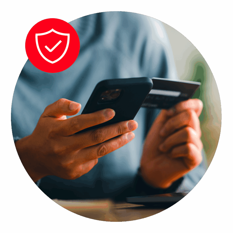 man holding telephone and credit card