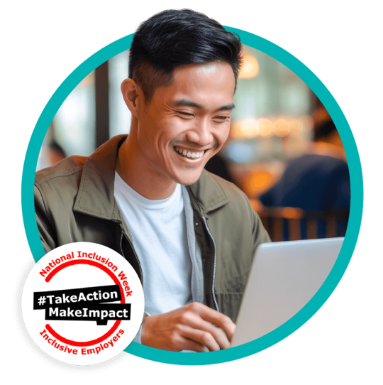 Man on laptop smiling